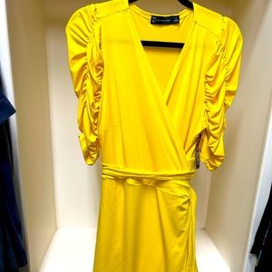 Bright yellow wrap dress with ruched sleeves